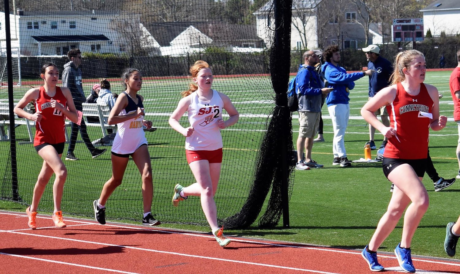 Isabella Barr and Lauren Murphy compete in the 1500-meter run.